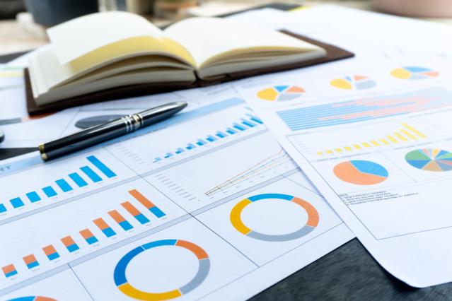 documents with graphs on a desk