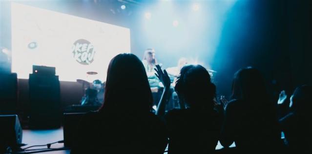 Music concert with a person onstage in front of the Smokefree Rockquest logo