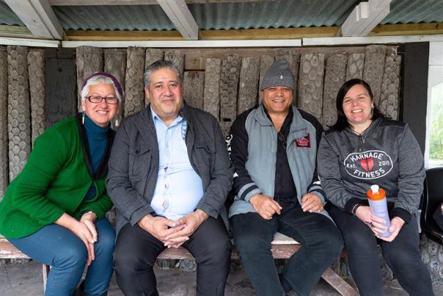 A group of adults from the Smokefree sector sitting together